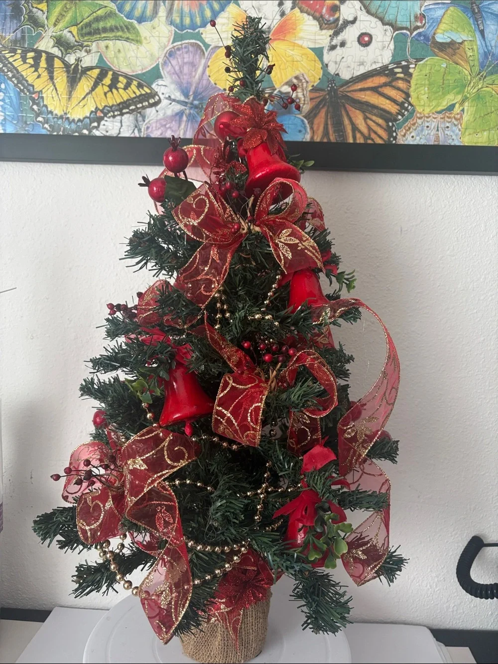 Decorative Holiday Tree with Red Ribbon and Bells